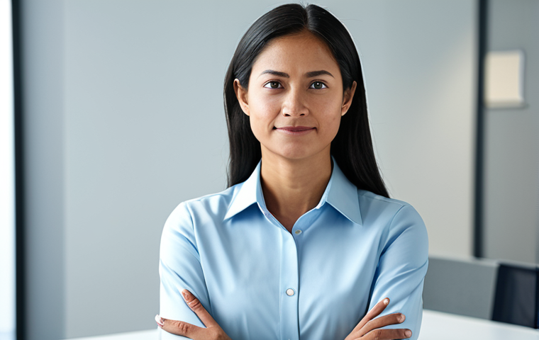 A professional individual, embodying quiet resilience and inner strength, in a well-lit, contemporary office setting. The subject is fully clothed in professional, modest business attire, with attention to subtle micro-expressions that convey deep emotion and determination. Focus on perfect anatomy, correct proportions, natural pose, well-formed hands, and proper finger count. The lighting is soft and inviting, emphasizing a thoughtful yet approachable demeanor. High-quality professional photography, safe for work, appropriate content, fully clothed, family-friendly.